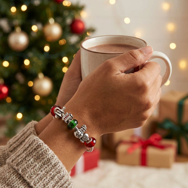 European bead Christmas bracelet with snowman tree present and mitten shaped beads in green red and silver Pandora compatible
