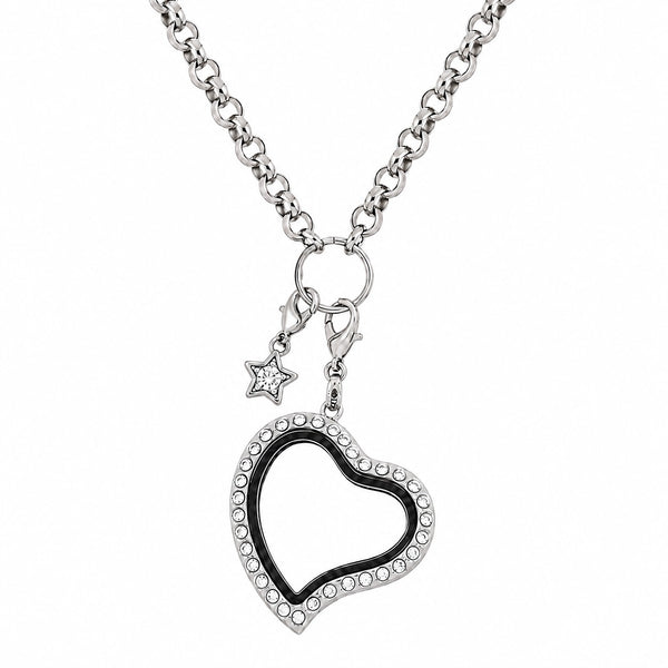 A silver-toned floating charm locket heart necklace, bordered by small clear rhinestones, hanging from a silver rolo chain with a small star dangle charm on a white background.