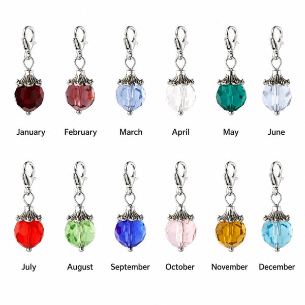 12 Faceted Glass birthstone dangle beads with lobster clasp in garnet, amethyst, aquamarine, diamond, emerald, ruby, peridot, sapphire, pink tourmaline, citrine and topaz on white background.