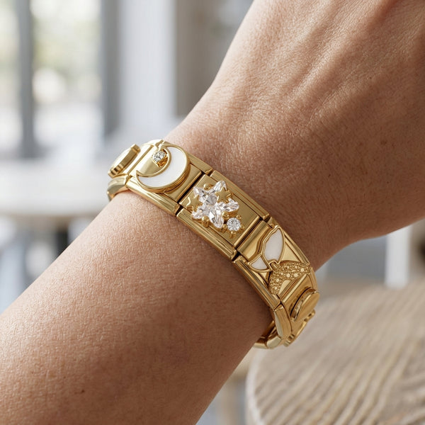 Gold 9mm Italian charm bracelet with diamond star and moon on a wrist against a blurred indoor background