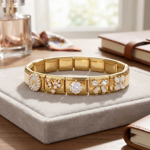 Gold Italian charm bracelet with decorative elements on a soft surface