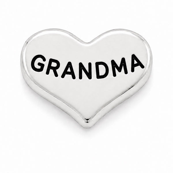A polished silver heart-shaped Floating charm with the word 'GRANDMA' engraved in bold black capital letters, shown on a clean white background.