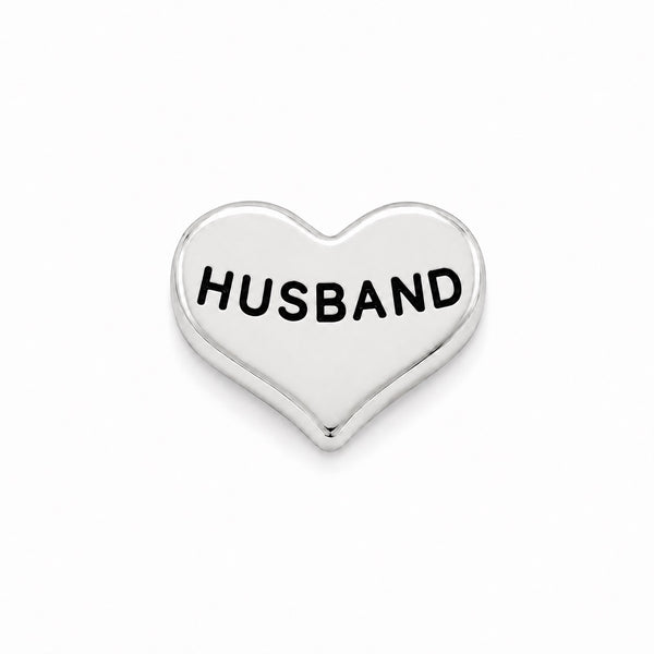 A polished silver heart-shaped Floating charm with the word 'HUSBAND' engraved in black capital letters, centered on a clean white background.