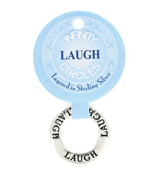 A silver plated infinity circle charm featuring the word 'LAUGH' engraved around the circle , attached to a light blue paper hang tag that reads 'INFNTY CIRCLES' and 'Layered in Sterling Silver'.