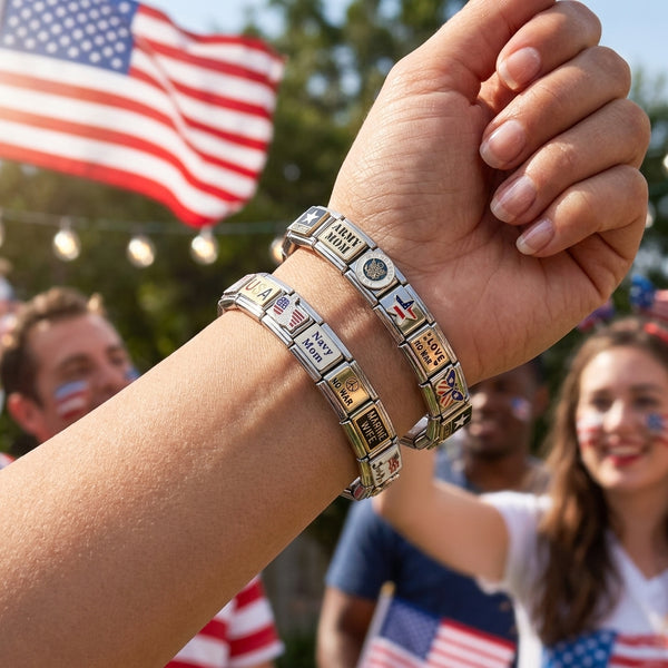 Person wearing multiple 9mm Italian charm bracelets with patriotic and military links with background of people and an American flag.