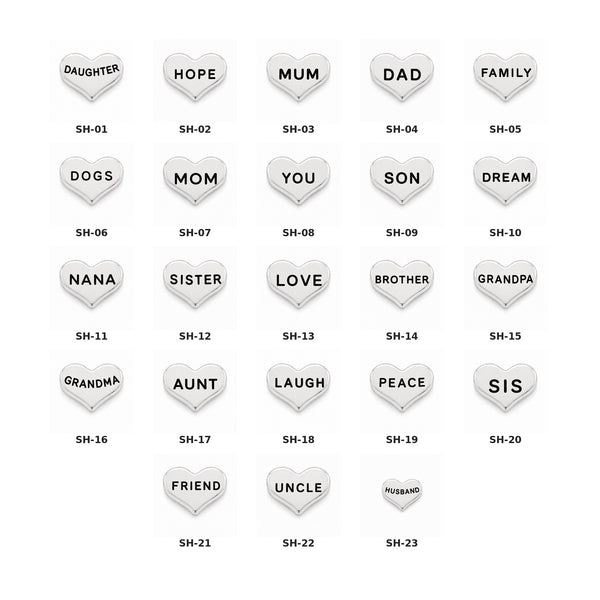 A grid of small heart-shaped floating charms on a white background, each with a different family-related word such as daughter, hope, mum, dad, family, dogs, you, son, dream, nana, sister, love, brother, grandpa, grandma, aunt, laugh, peace, sis, friend, uncle, and husband. Each heart has a printed code underneath, for example SH-01 through SH-23.