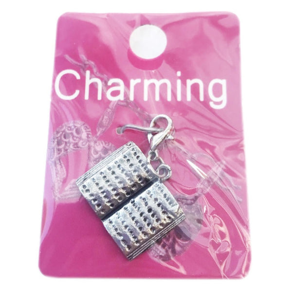 Silver charm shaped like an open book with lobster clasp for charm bracelets