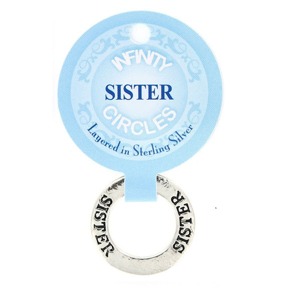 A silver plated infinity circle token chip charm engraved with SISTER featuring a light blue circular tag that reads 'Sister Infinity Circles' and 'Layered in Sterling Silver'.