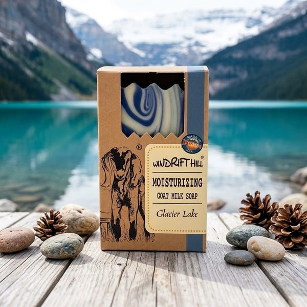 Windrift Hill goat milk soap packaging with a scenic background of a lake and mountains.