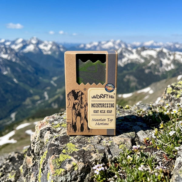 Windrift Hill Goat milk soap bar with packaging on a mountain peak