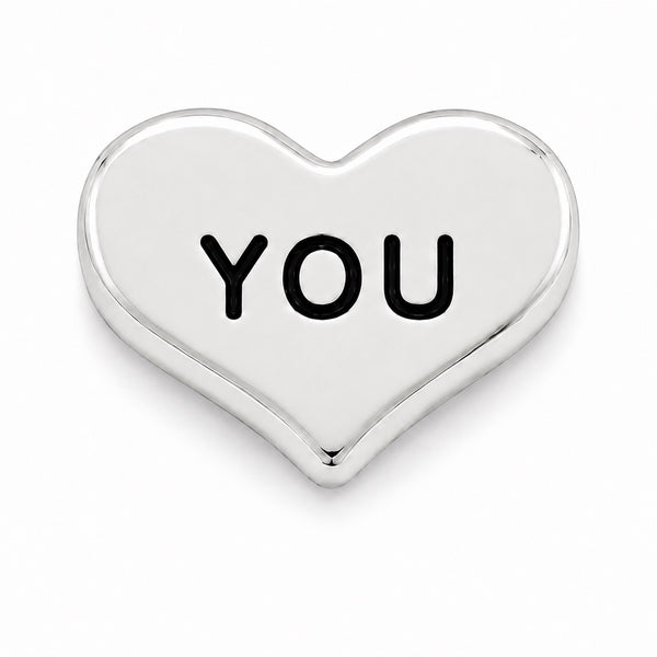 A polished silver heart-shaped Floating charm with the word 'YOU' engraved in bold black capital letters, shown on a clean white background.