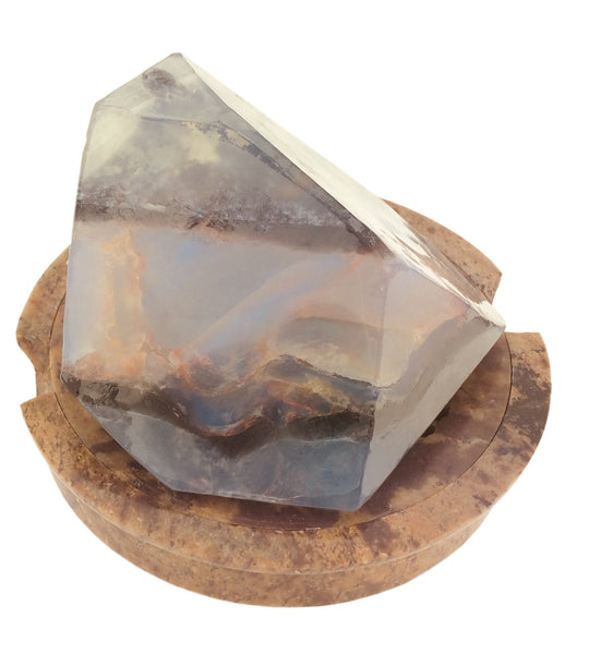 Handmade Round Soapstone Soap Dish With Removable Lattice Top holding a moonstone soaprock