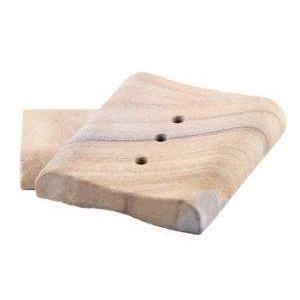 Natural sandstone carved into a soap dish with drainage holes to prevent mushy bars